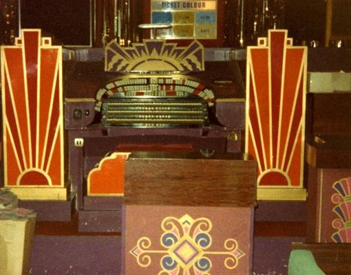 The Mighty Compton Organ with boarded front following an incident which broke the glass surround, painted and not at its glorious restored best