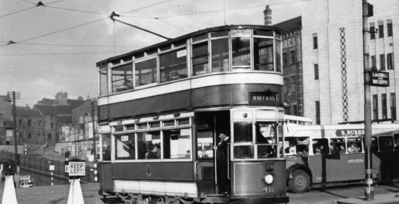 Tram passing The Plaza Facade when Mersey Square was the hub of local transport